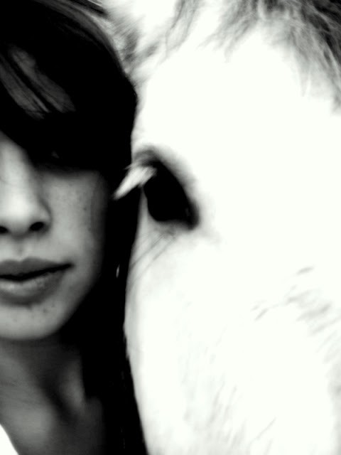 black and white shot of a girl and her pony
