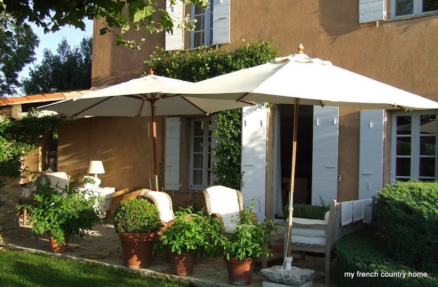 sitting area with white umbrellas and comfy chairs