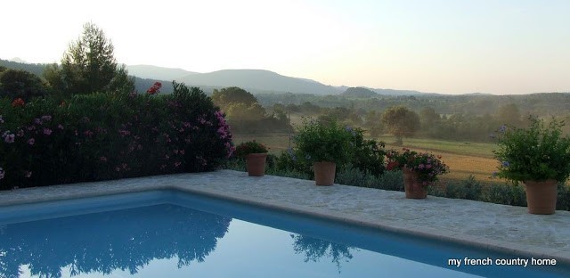 summertime-living-easy-2-my-french-country-home view of the valley at sunrise, with a pool in the foreground