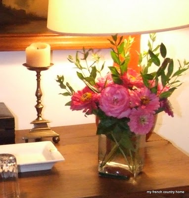 summertime-living-easy-2-my-french-country-home small vase of flowers on a bedside table with lamp