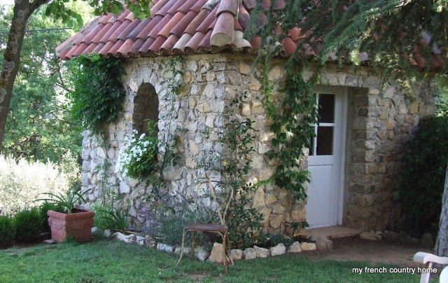 small stone outbuilding in the garden