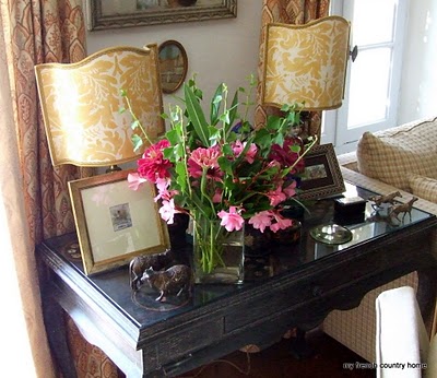 summertime-living-easy-2-my-french-country-home fresh flowers on a side table with pictures and lamps