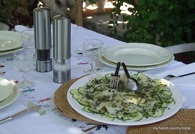 summertime-living-easy-2-my-french-country-home a fresh cucumber salad on a table with white place settings