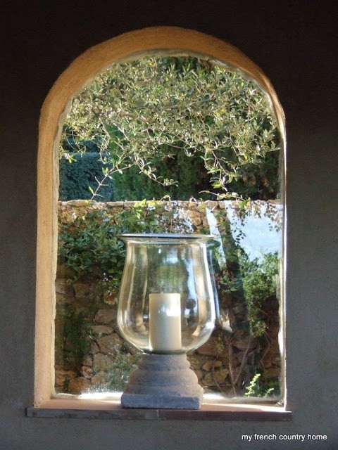 summertime-living-easy-2-my-french-country-home detail shot of a candle in a glass bowl, sitting in a rounded window
