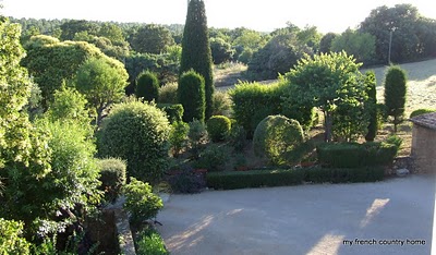 large garden with topiaries and boxwoods