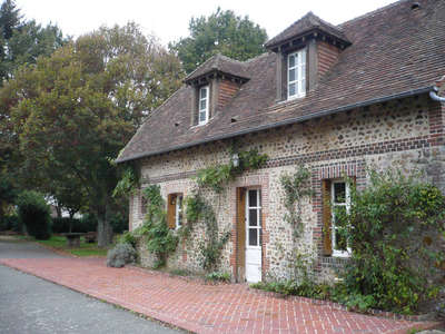 normand house with stone and brick patio