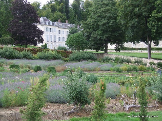 stone walled potager with chateau in the background