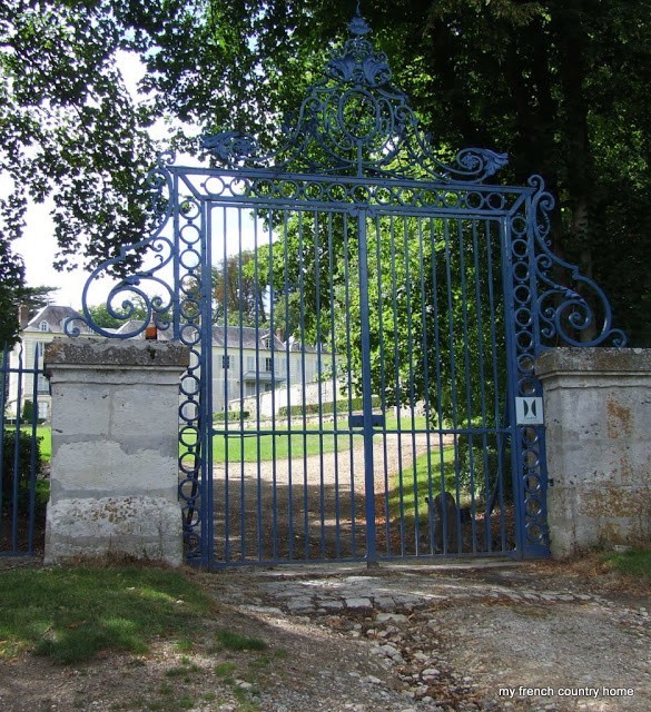 large blue wrought-iron gate