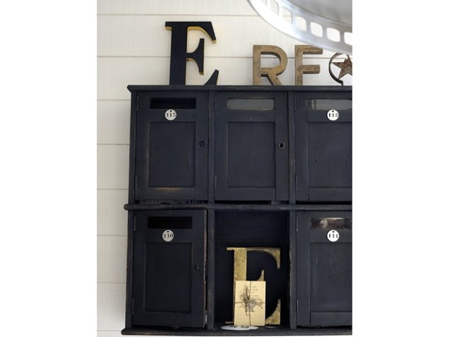 black cabinet with decorative letters in black and neutral