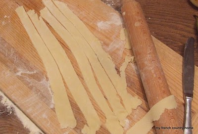 strips of dough cut on a board