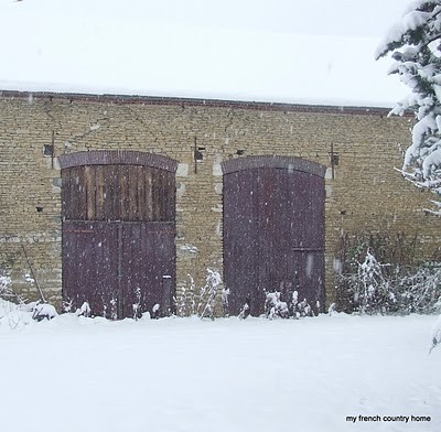 snowy barn with large doors