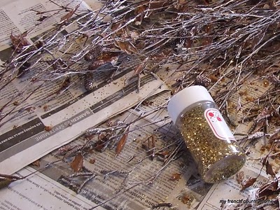 white-painted birch branches with gold glitter