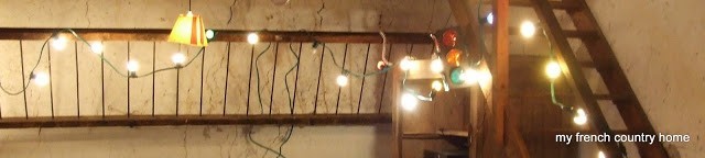 party lights strung up in a barn