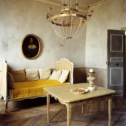 neutral bedroom with day bed and table