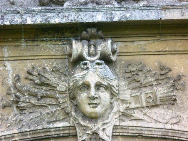 detail of an angel's face on the stone facade