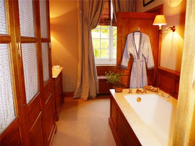 wood-paneled bathroom with large bathtub