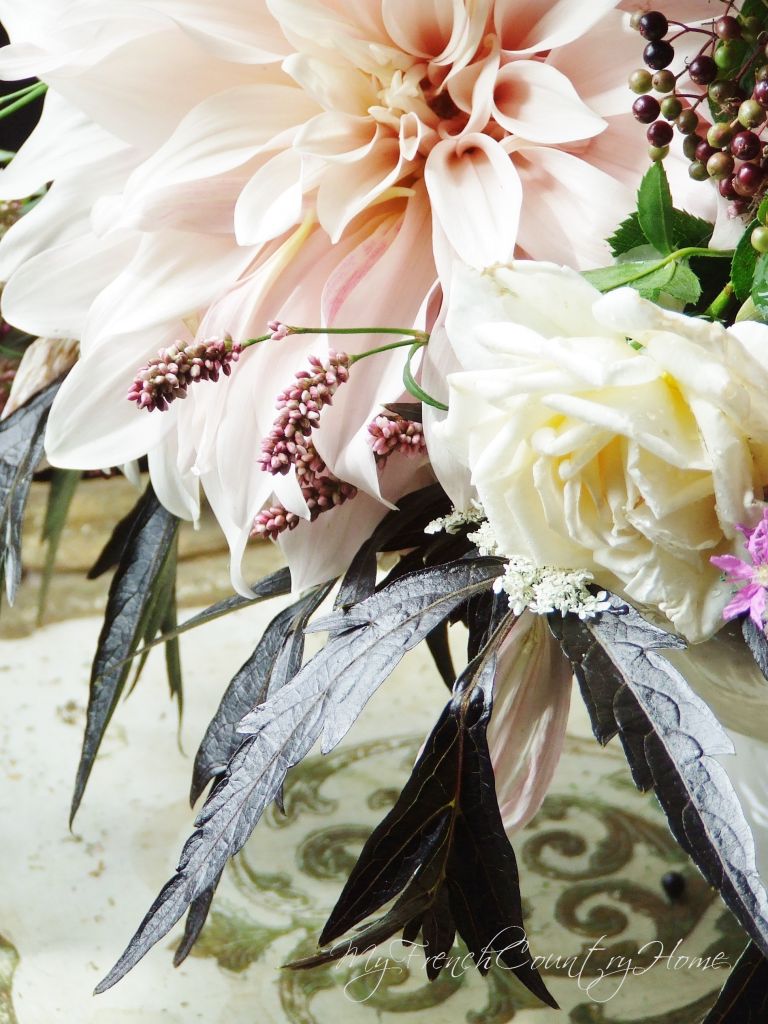 bouquet of dahlias and elderberies on a table