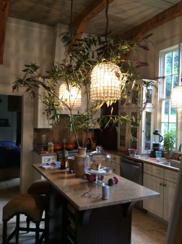 real-french-kitchens-home-pics-my-french-country-home kitchen with island and large light fixture with branches