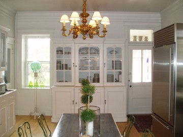 real-french-kitchens-home-pics-my-french-country-home white kitchen with large china hutch and gold chandelier