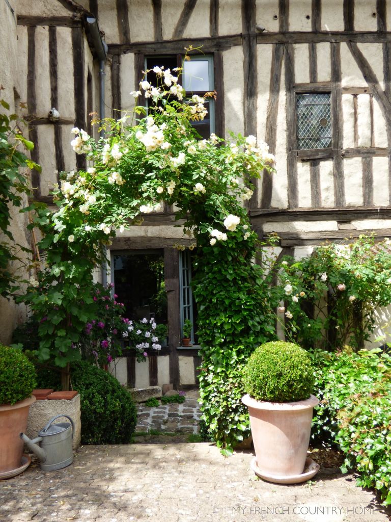 TIMBERED HOUSE WITH BOX BUSH