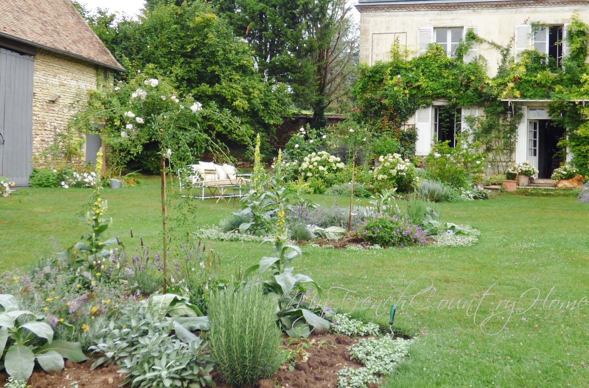 parterre beds in front of my french country home