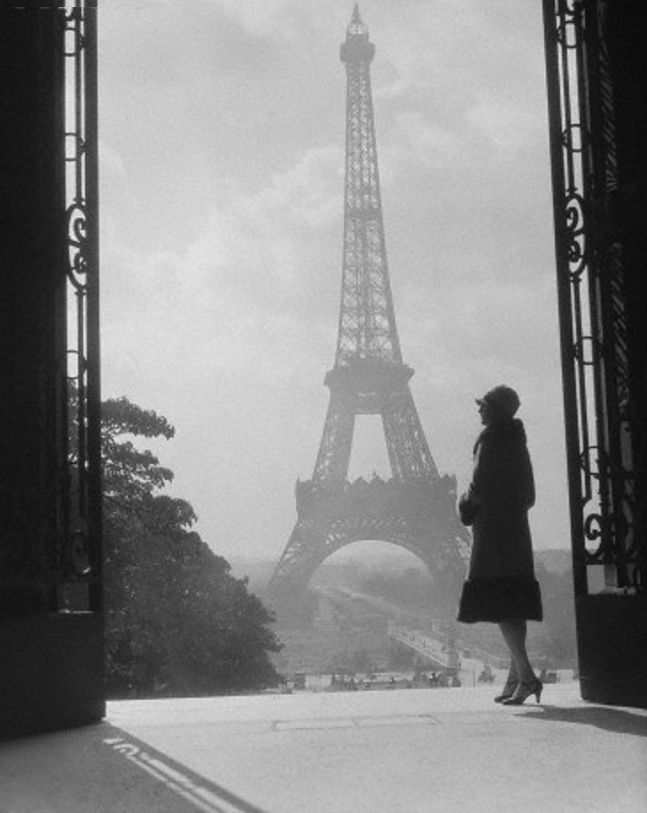 woman in front of eiffel tower