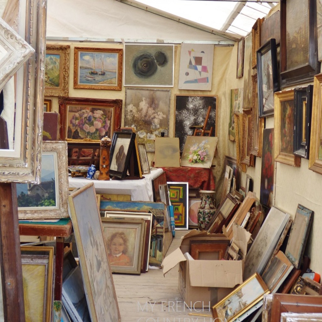 art for sale at an antique fair
