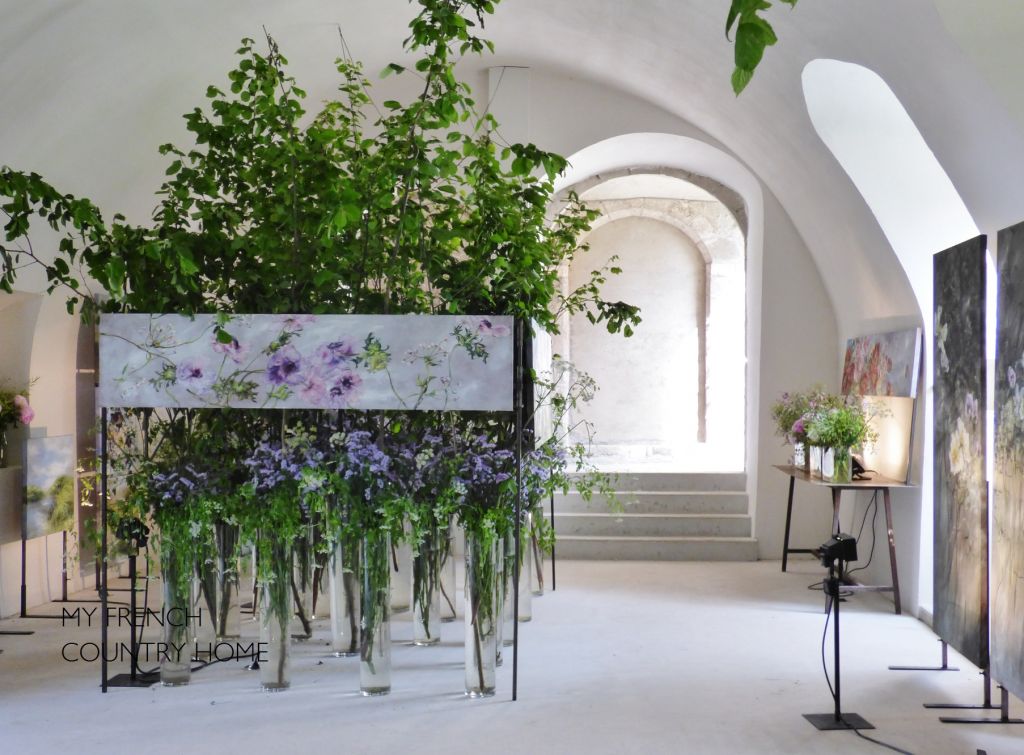 flowers and paintings in art exhibiton