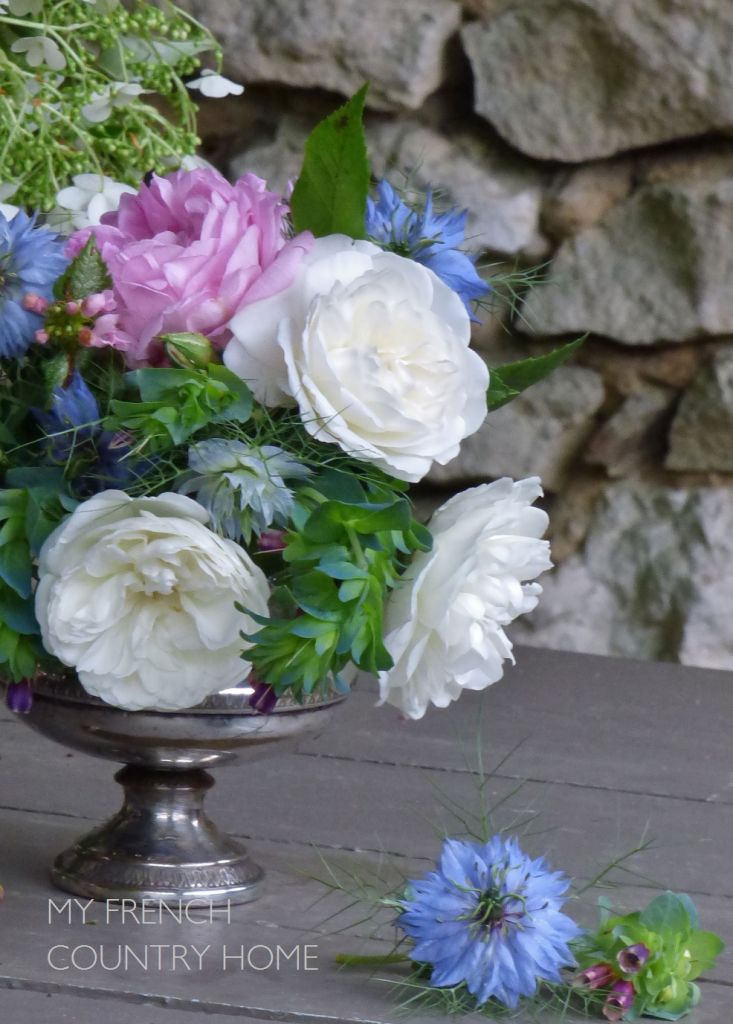 roses and peonies in silver vase