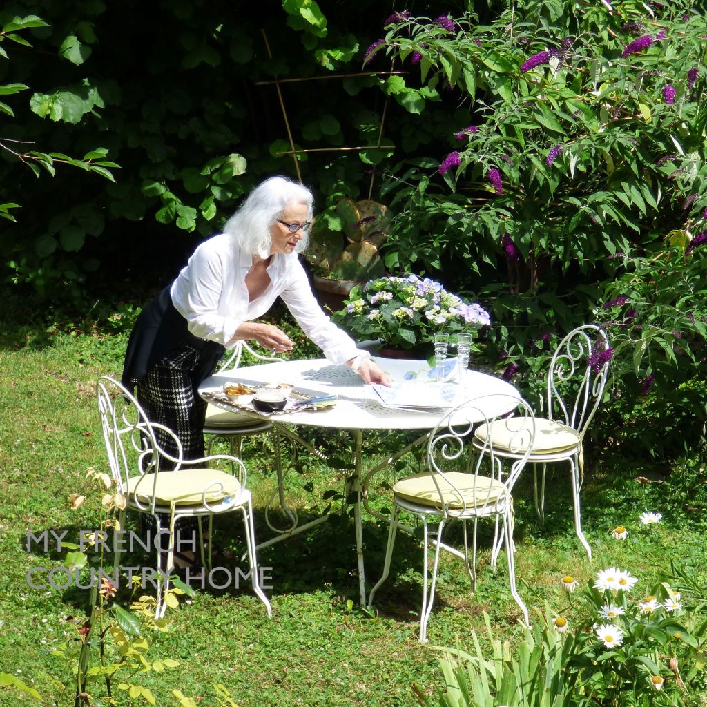 ml daveau queysanne in garden with white table