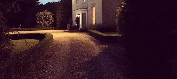 country house lit up at night