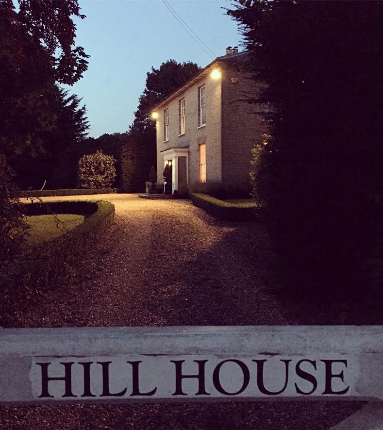 country house lit up at night