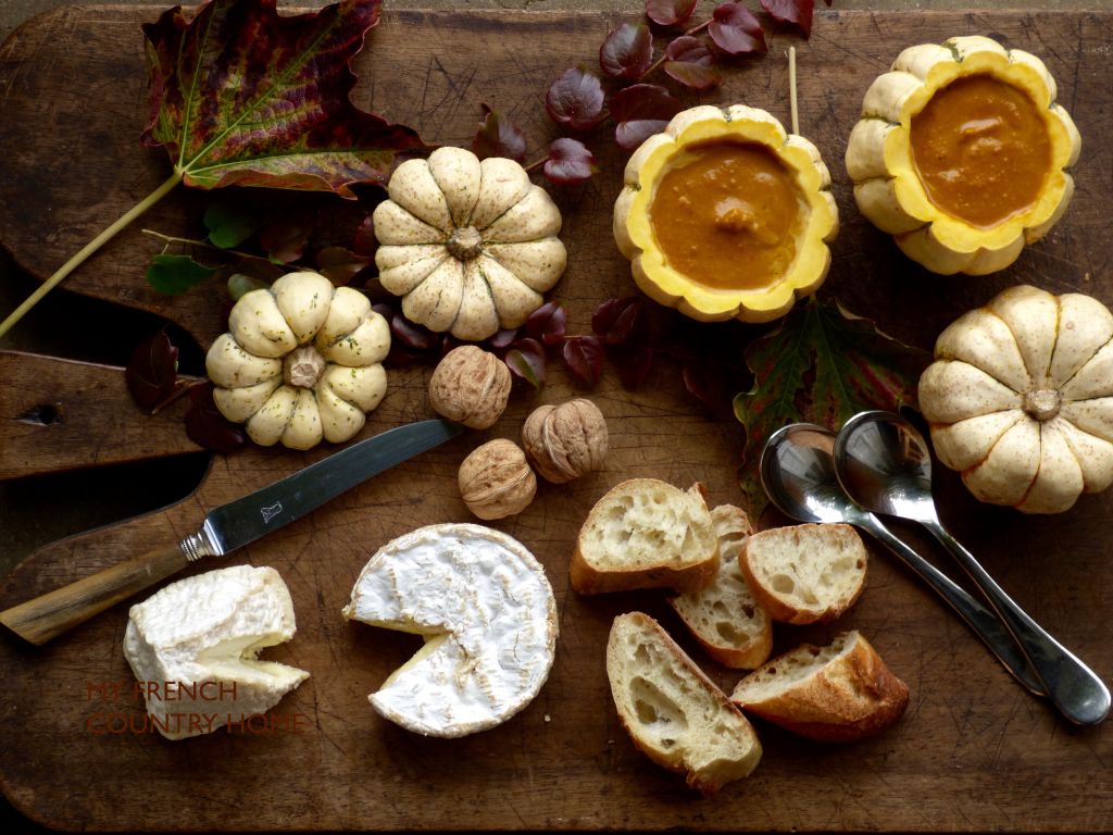 pumpkin soup in pumpkin with bread and cheese