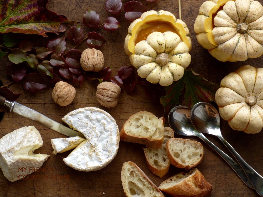 pumpkin soup in pumpkin with bread and cheese