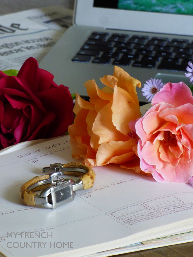 desktop with watch , roses and agenda