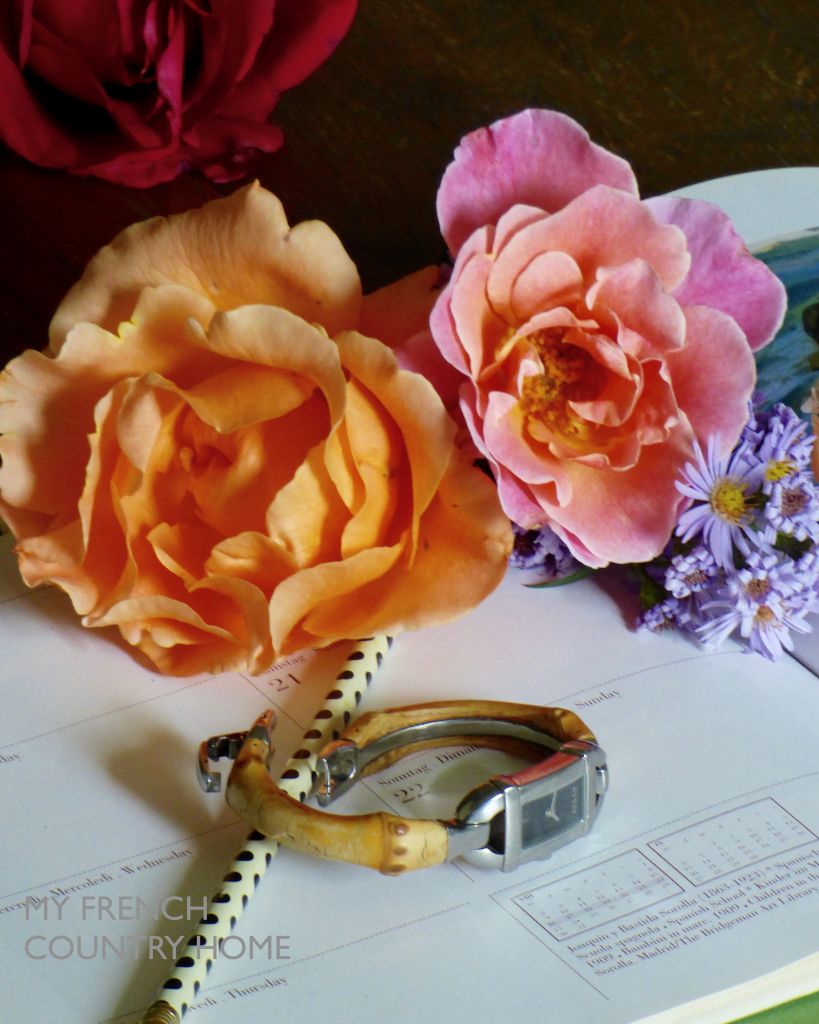 desktop with watch , roses and agenda