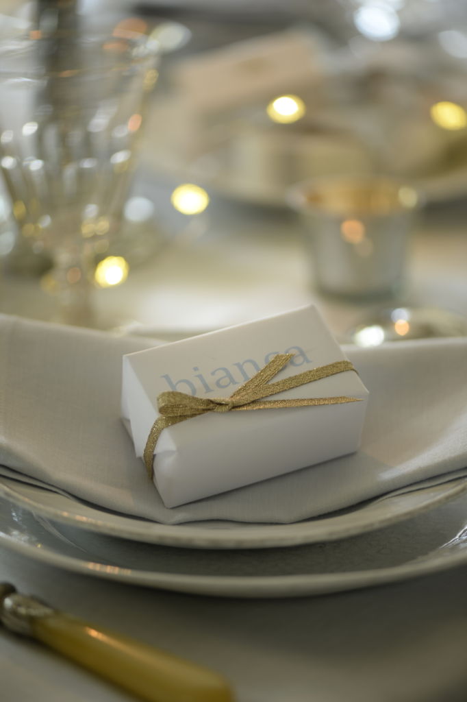 gift on plate at christmas table