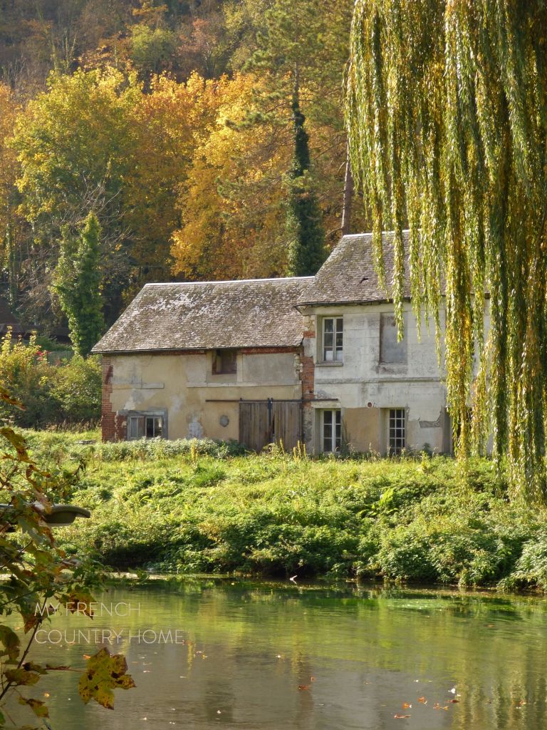house by river in normandy