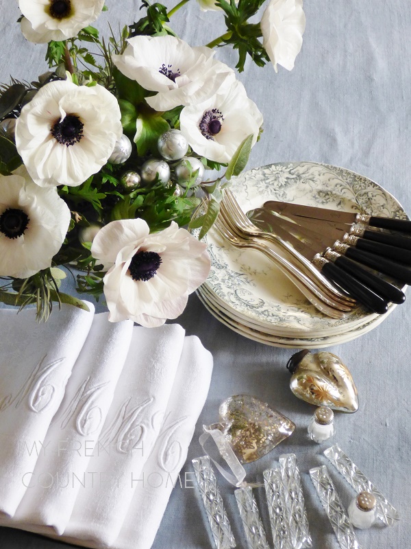 preparing a christmas table in grey