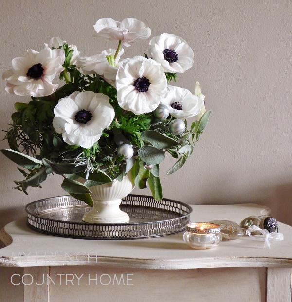 preparing a christmas table in grey