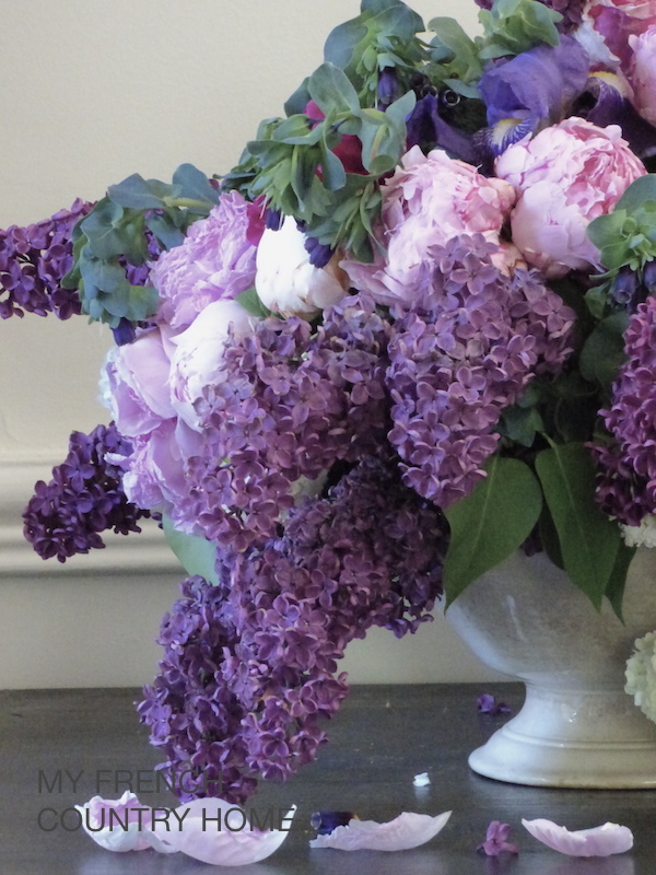 lilac in bouquet with roses and peonies