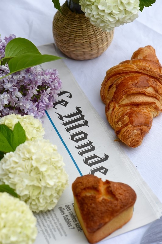 croissant and newspapers