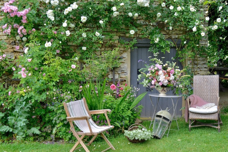 summer flowers in a big bouquet with garden chairs