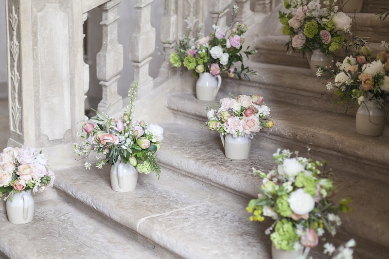 Bouquets on the staircase at Chateau de Moissac | My French Country Home Tours