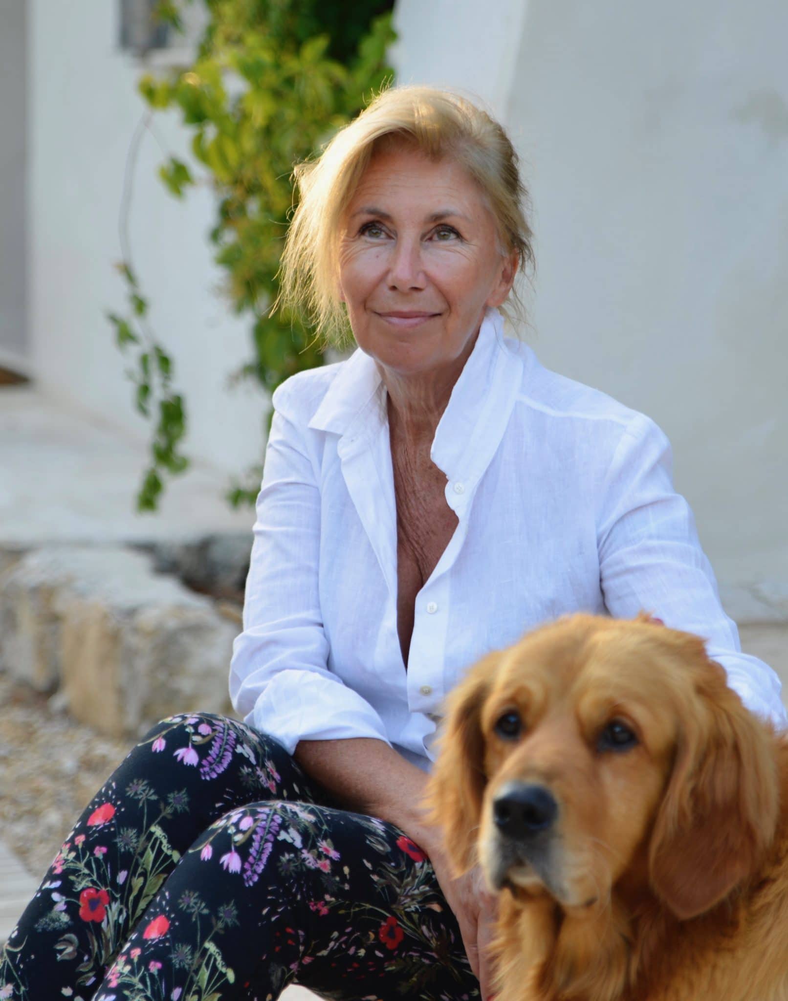 women in white shirt with dog