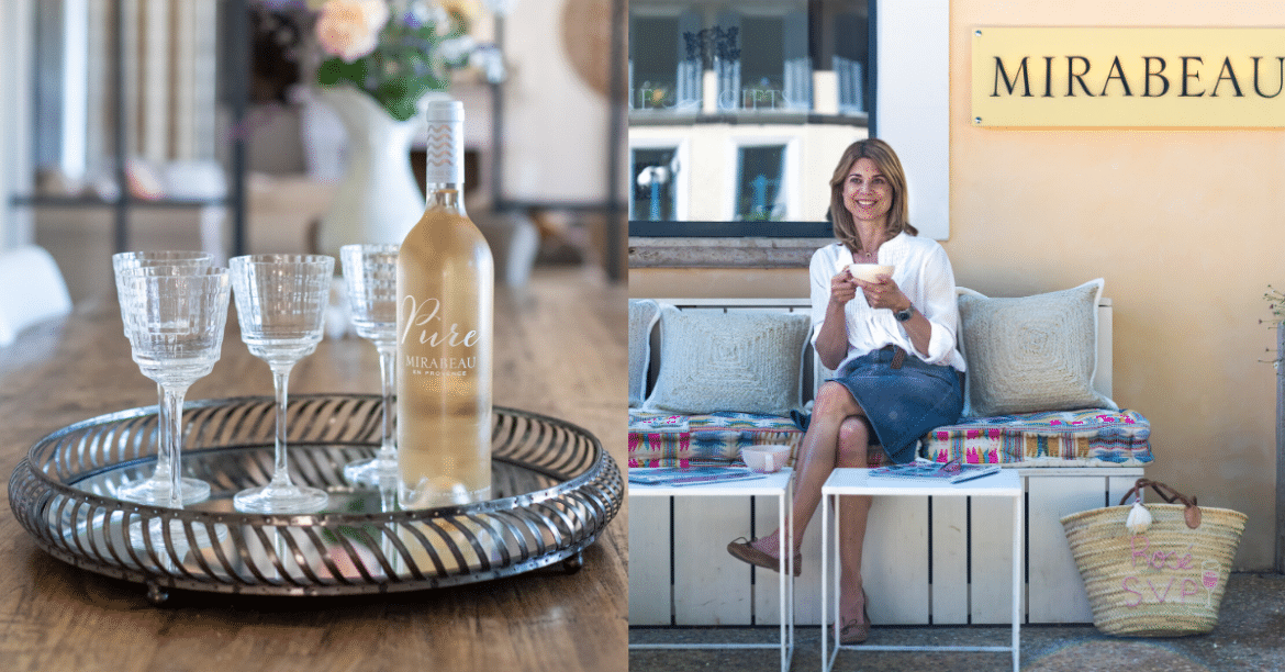 wine bottle with glasses and women sitting on bench