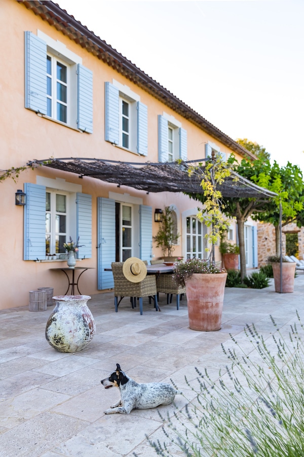 pink house with blue shutters