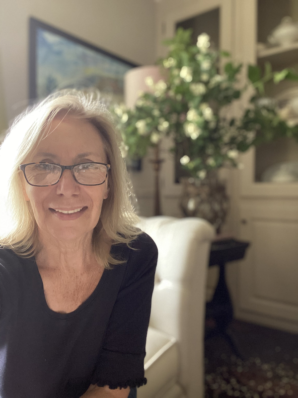 woman in glasses and dark shirt