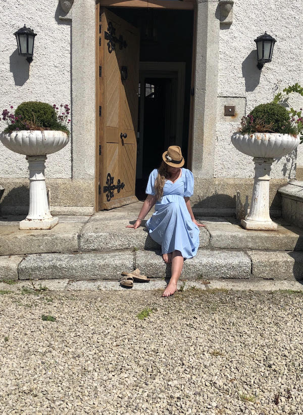 women in blue dress on steps