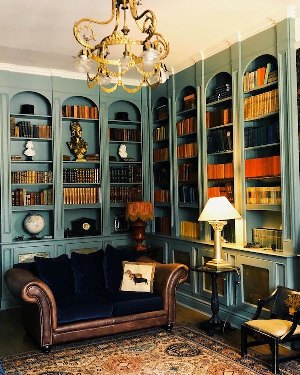 library with blue couch and blue walls